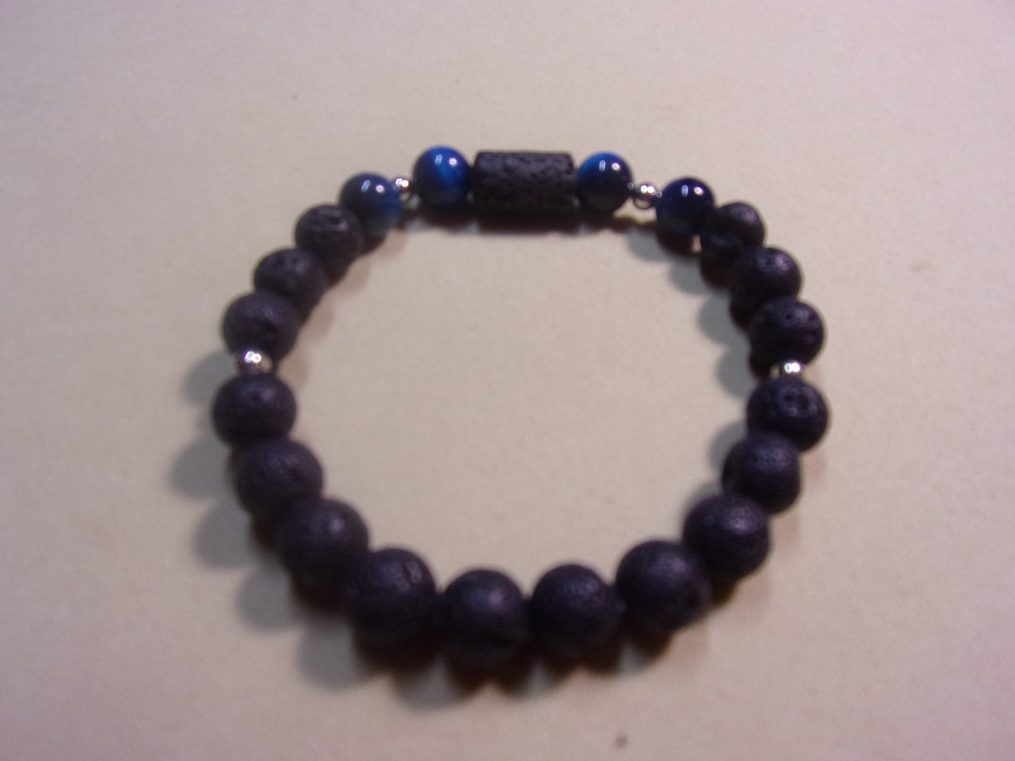 black stone bead w/3 blue tiger eye beads