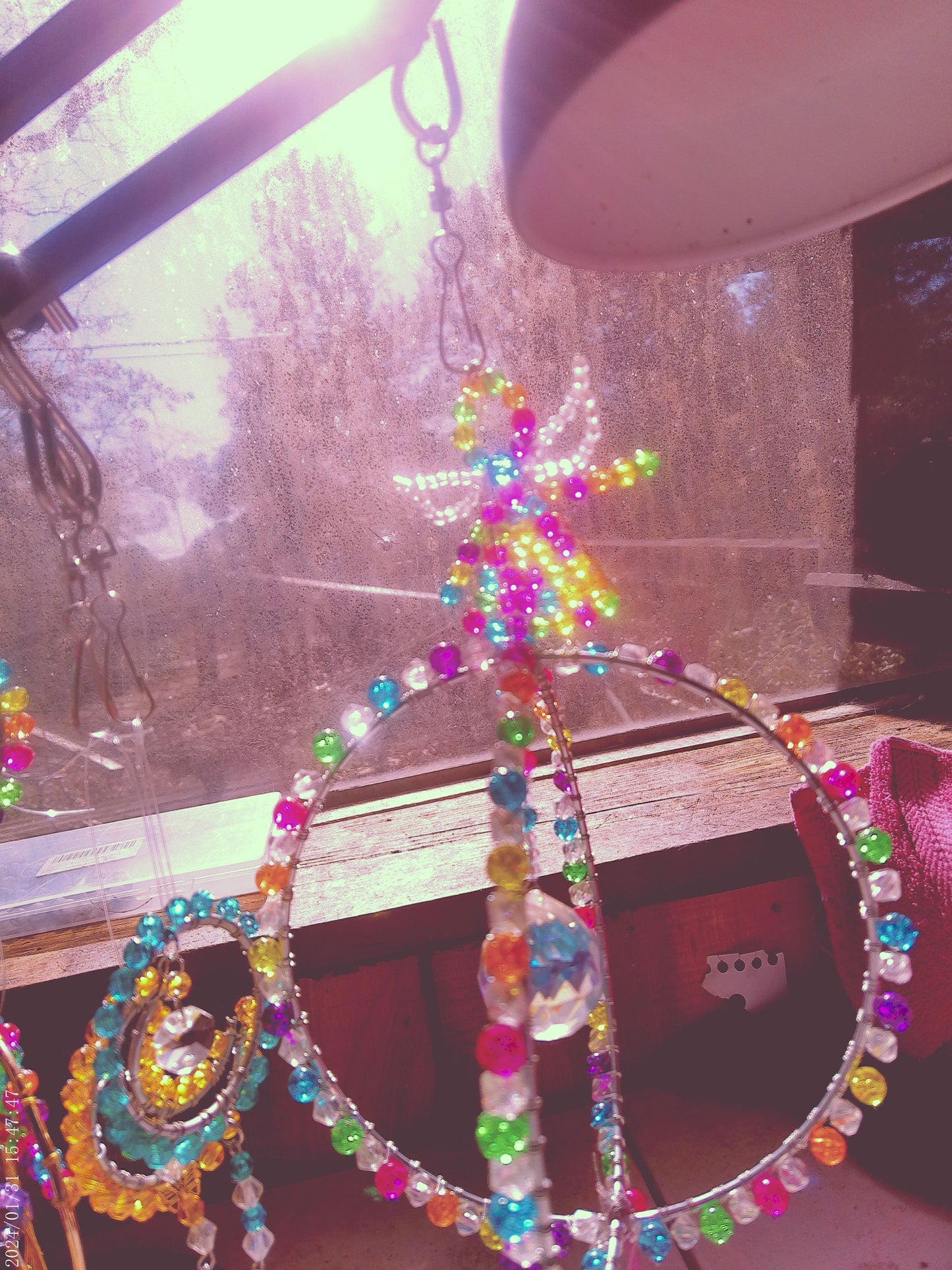double circle Sun Catcher w/angel on top