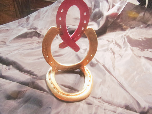 Cancer awareness ribbon made w/horseshoes